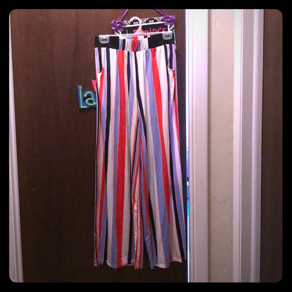 Stripe silk pants with pockets and elastic waist.